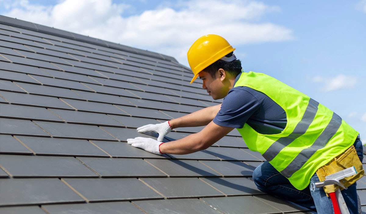 Roofing expert fixes home energy efficiency from damaged roof.