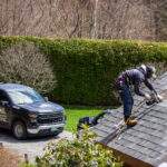 Roofing contractor in Vermont performing spring roof maintenance.
