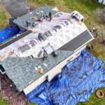Above view of home receiving a roof replacement. Get a roof replacement quote from your local roofing contractor.