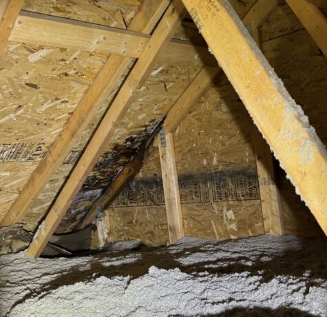 Inside of leaking roof with storm damage.