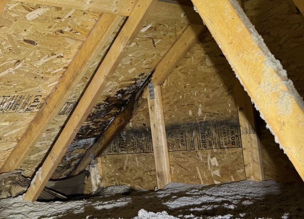 Inside of leaking roof with storm damage.