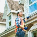 local roofing expert conducts roof inspection